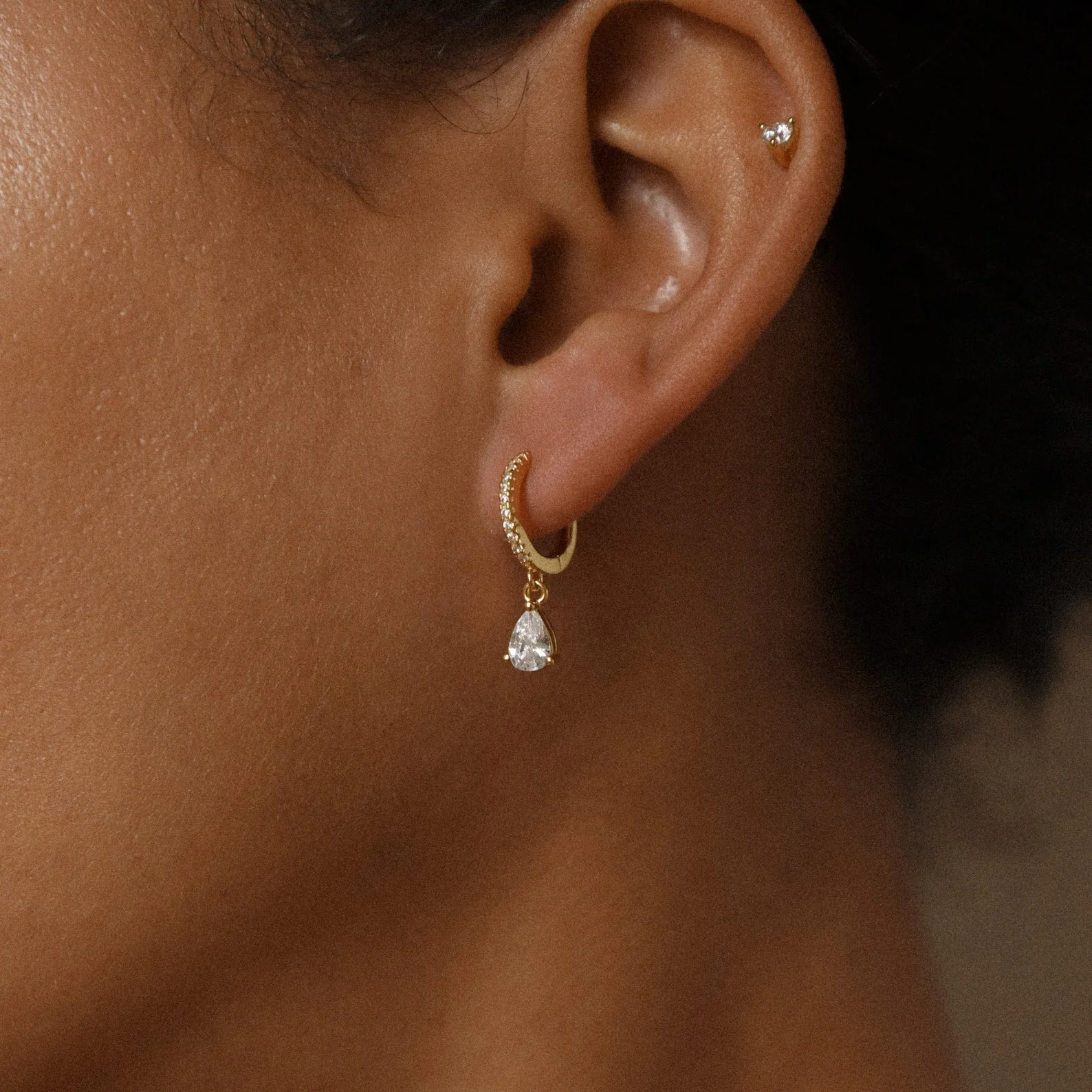 Diamond Drop Huggies in 18K Gold - Image 2