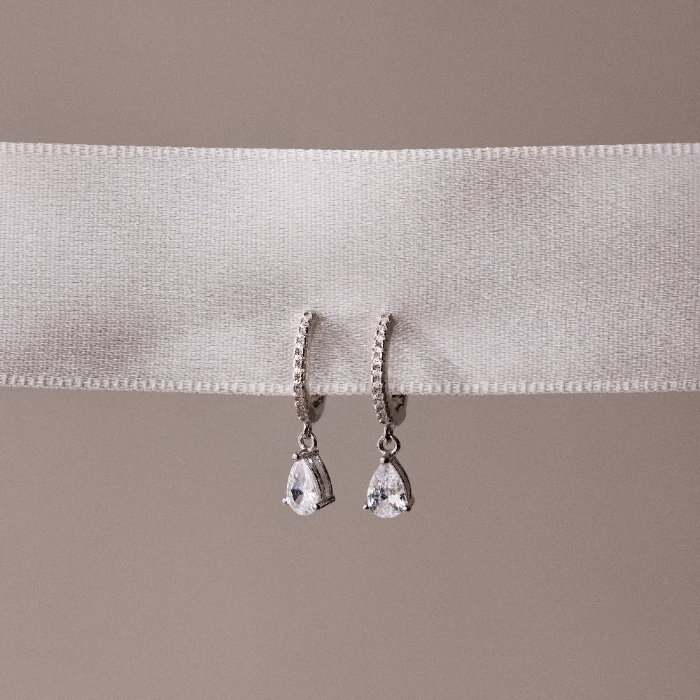 Diamond Drop Huggies in Silver - Image 7